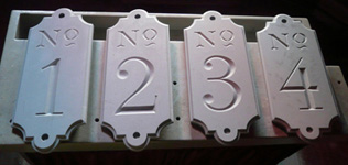 hnad carved door numbers